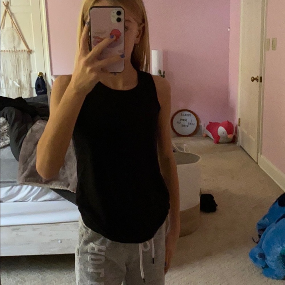 black athletic shirt with knot in back